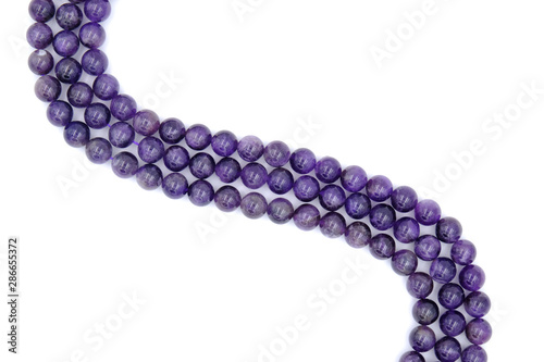 Purple amethyst natural stone round shape bead isolated on white background