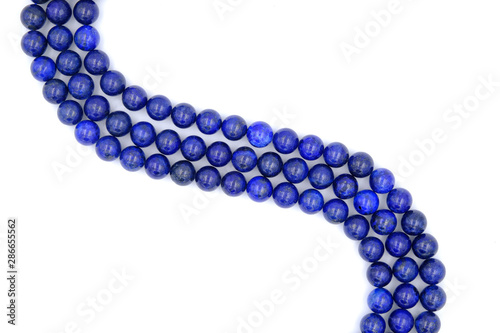 Blue lapis lazuli natural stone round shape bead isolated on white background