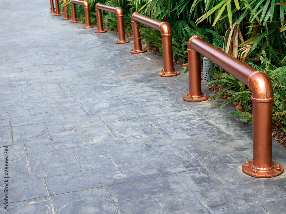 Empty outdoor bicycle parking. Bicycle lock made by industrial metal pipes in copper color. Empty outdoor bicycle parking. Bicycle lock made by industrial metal pipes in copper color.