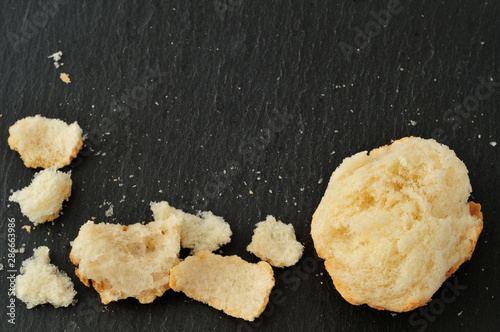 Italian bread, crumbs and bits, on slate plate