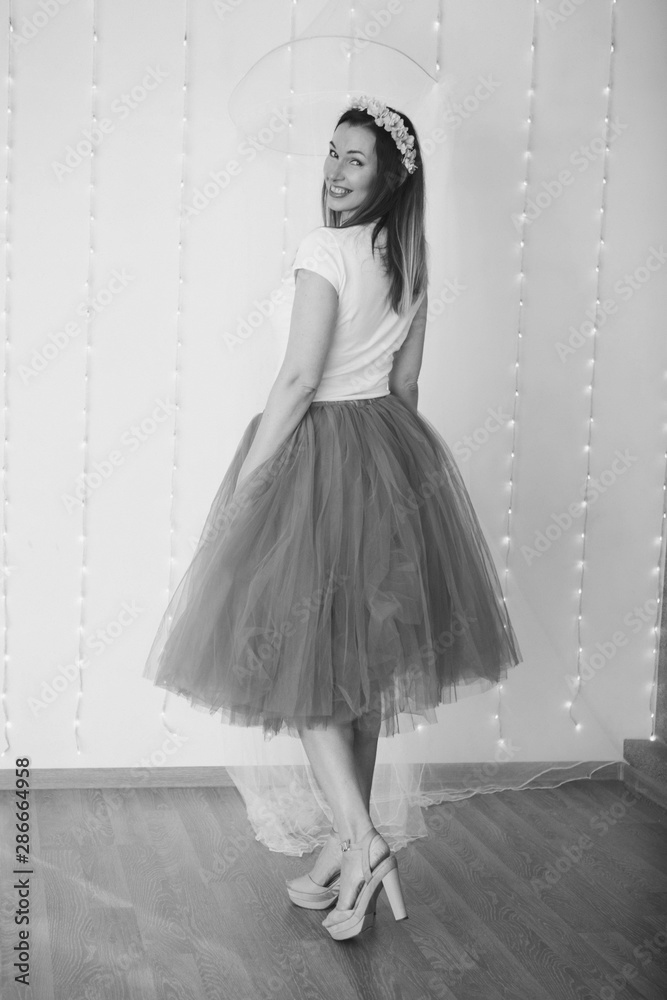 isolated photo: beautiful model with long hair shows off clothes. the concept of modeling business, is casual clothes isolated photo: beautiful model with long hair shows off clothes. the concept of modeling business, is casual clothes
