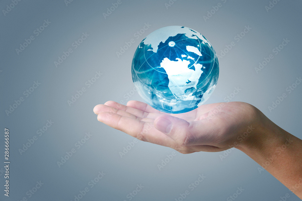 glass globe in hand glass globe in hand