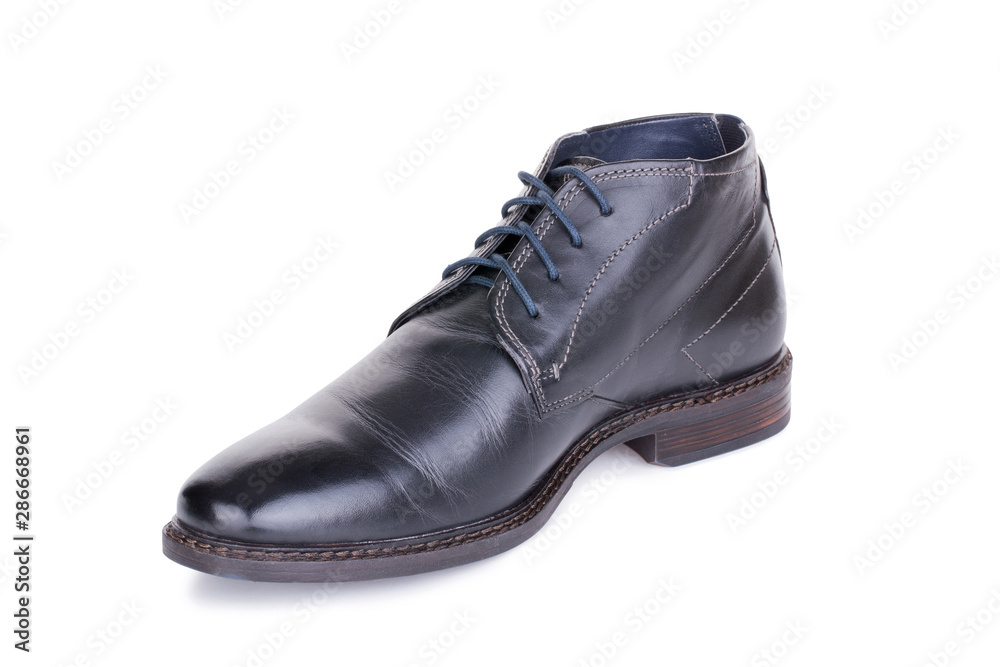 One classical black laced autumn man leather ankle boot shoe isolated. One classical black laced autumn man leather ankle boot shoe isolated.