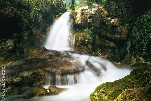 Fototapeta Naklejka Na Ścianę i Meble -  Beautiful waterfall, deep inside the forest.