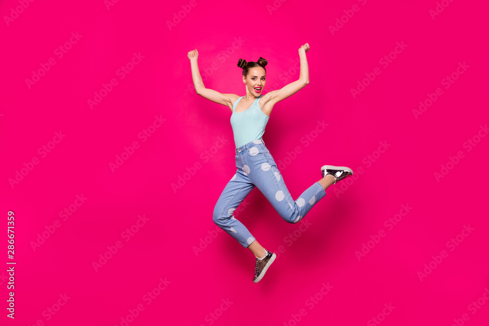 Full size photo of pretty lady raising hands fists wearing blue singlet isolated over fuchsia background