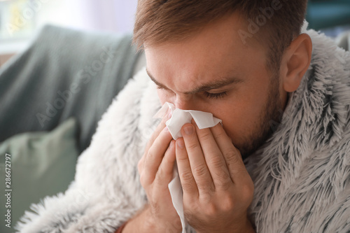 Man ill with flu at home