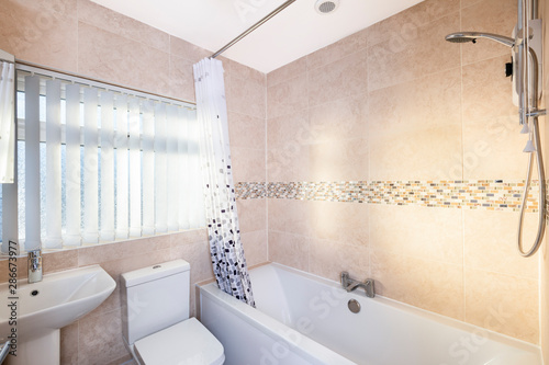 Modern bathroom with bathtub and shower