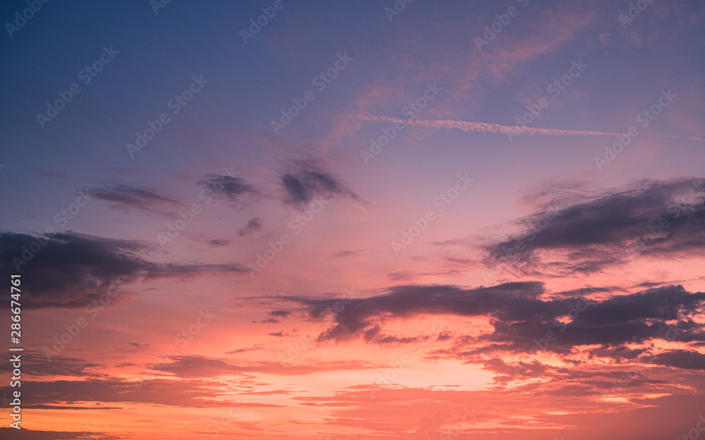 Sunset sky with clouds background.