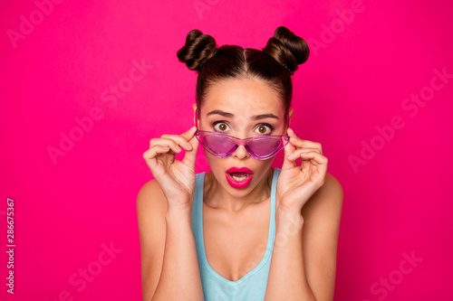 Closeup photo of pretty lady eyes full of fear wear sun specs blue tank-top isolated pink background