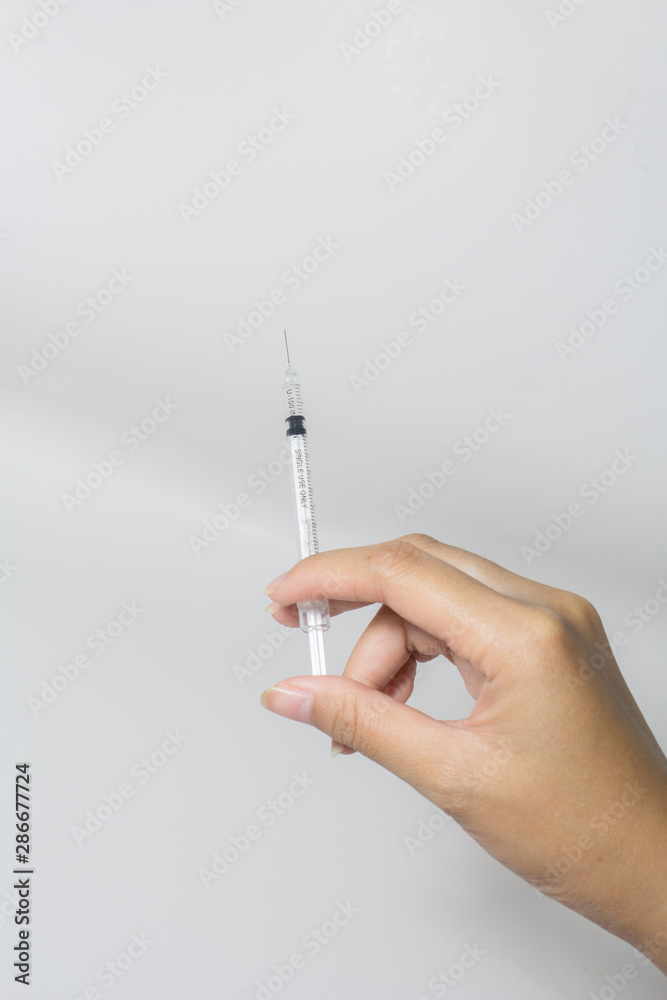 Is using a syringe handle Is the treatment of diseases And close-up photography On a white background Is using a syringe handle Is the treatment of diseases And close-up photography On a white background