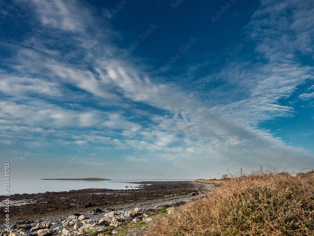 West coast of Ireland, Galway bay,  Hare Island. Clouds resemble bird shape. 