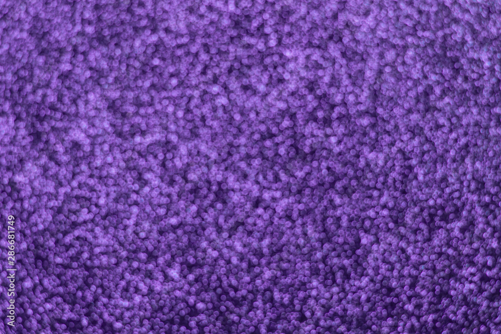 Abstract ultra violet background. Shiny glitter bokeh.