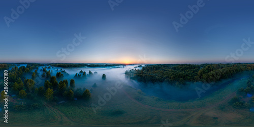 360-degree panoramic aerial view of the field  forest and river covered with a thick layer of morning fog