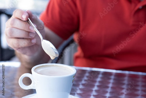 Closeup image of a businessman`s hands with coffee
