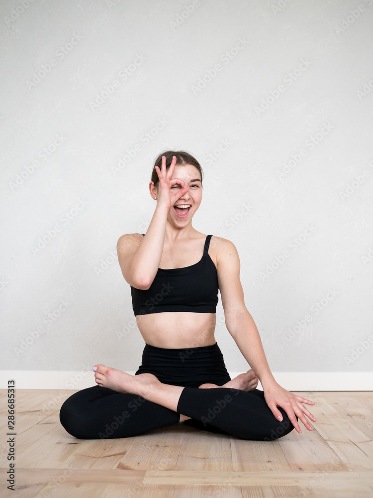 Attractive flexible girl doing yoga exercises Attractive flexible girl doing yoga exercises