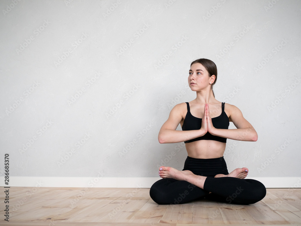 Fototapeta premium Attractive flexible girl doing yoga exercises