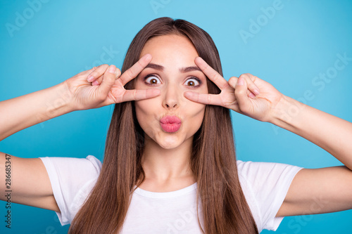 Close-up portrait of nice attractive lovely girlish cheerful cheery funny funky straight-haired lady showing double v-sign fooling isolated over bright vivid shine blue green teal turquoise background photo
