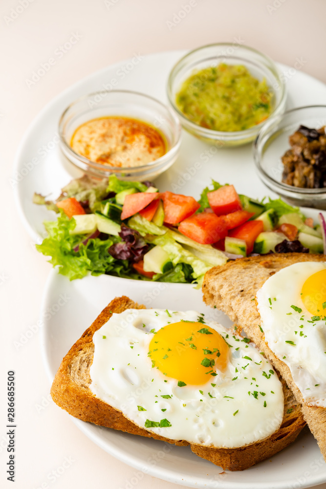 Fried eggs on toasted bread for breakfast Fried eggs on toasted bread for breakfast