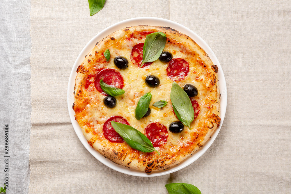 Tasty pizza with salami and cheese top view Tasty pizza with salami and cheese top view