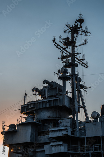 Ship's radiotower in port in sunset photo