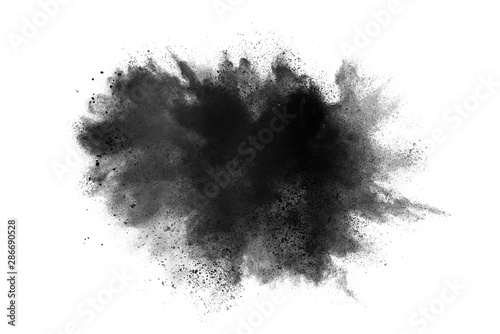 abstract powder splatted background. Black powder explosion on white background. Colored cloud. Colorful dust explode. Paint Holi. photo