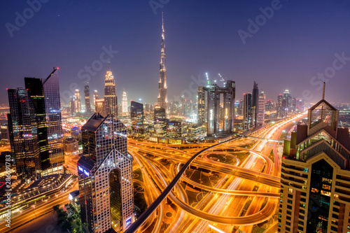 Dubai cityscape at blue hour with cars and traffic on roads and Burj Khalifa
