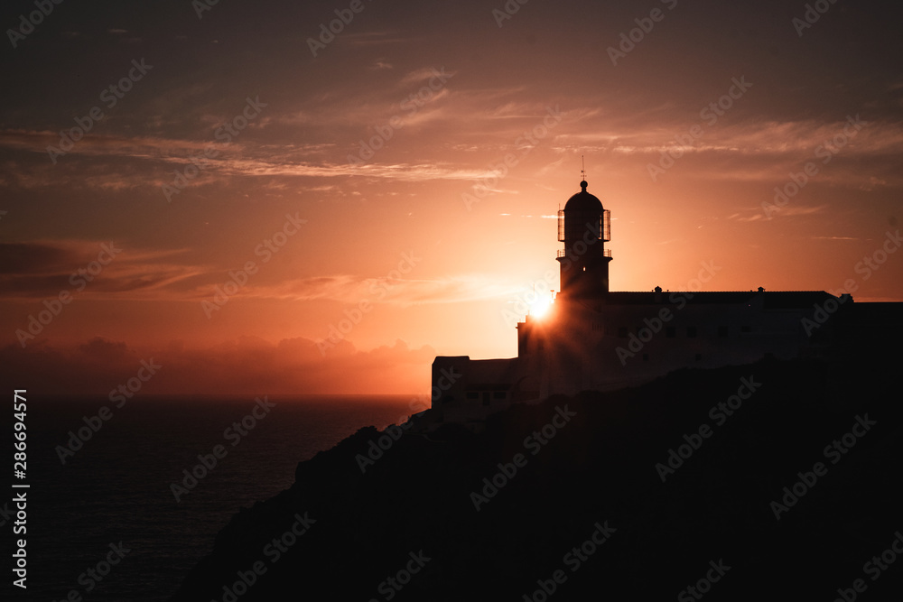 Lighthouse of Cabo Sao Vicente at sunset, in Sagres, Portugal. Farol do Cabo Sao Vicente. South Western tip of Europe.