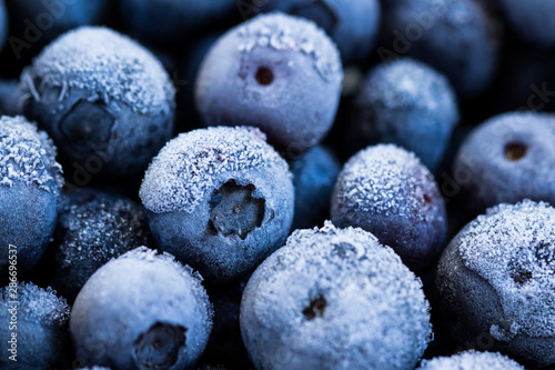 Frozen blueberries background. Healthy organic food. Close up.