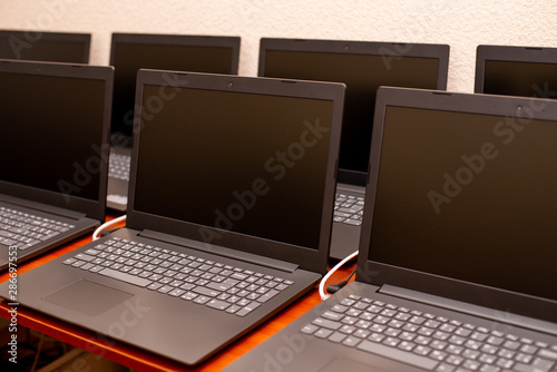 laptop, computer, business, notemany laptops are on the table. computer exhibition demonstration. it technology. Internet network office work. new gadgets