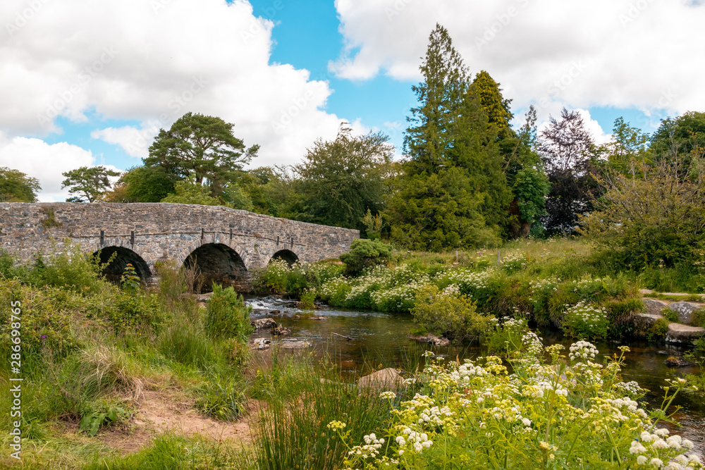 Old granite bridge at Postbridge, Dartmoor National Park, Devon, England