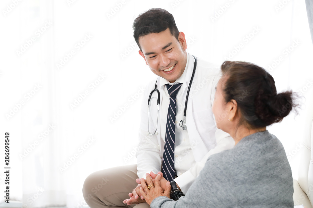 Asian young Doctor talking with Senior woman in hospital Asian young Doctor talking with Senior woman in hospital