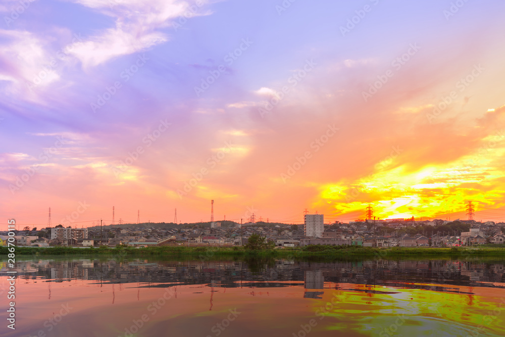 Sunset over village with reflection view. Sunset over village with reflection view.