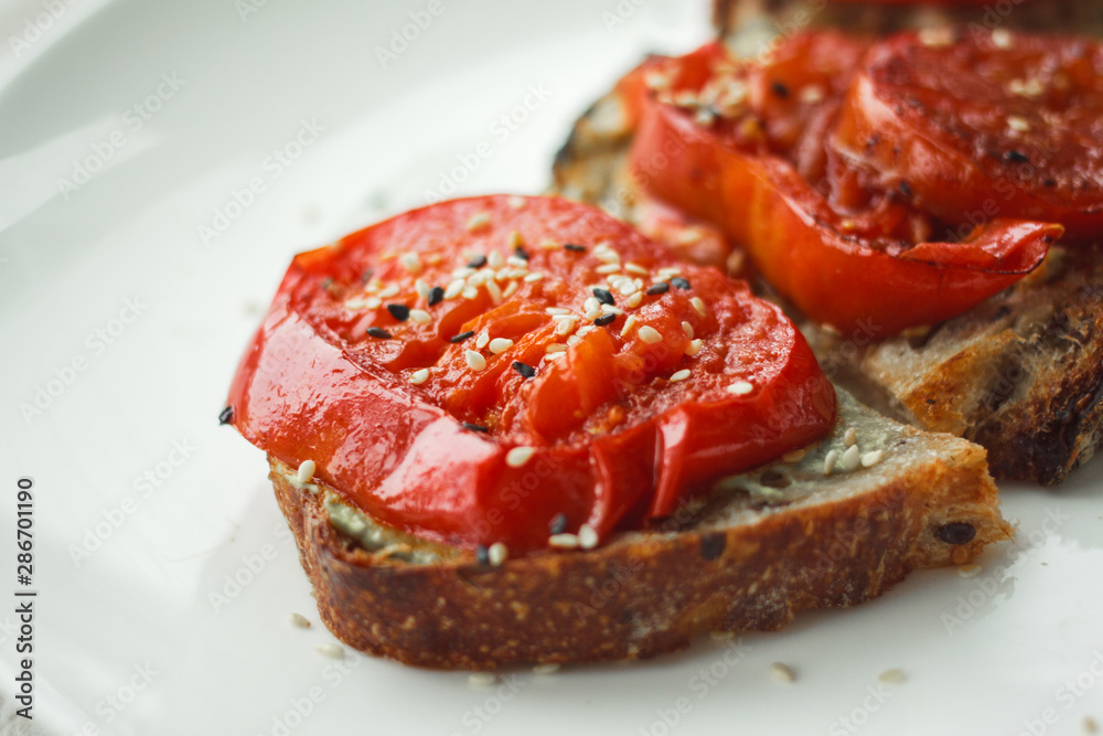 Tasty and healthy.Sandwich with cream cheese and tomatoes for Breakfast.