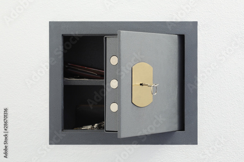 wall  open safe box on white background with copy space for your text