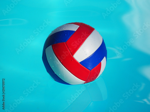 Volleyball in the swimming pool. photo