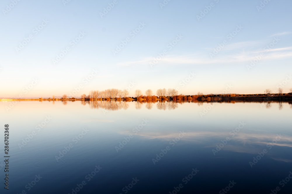 landscape in a lake at sunset
