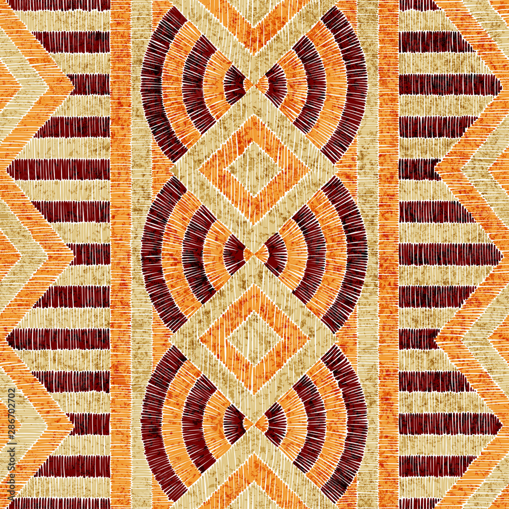 Embroidered ethnic seamless pattern. Aztec and tribal motifs. Striped ornament hand drawn. Print in the bohemian style. Vector illustration. Embroidered ethnic seamless pattern. Aztec and tribal motifs. Striped ornament hand drawn. Print in the bohemian style. Vector illustration.