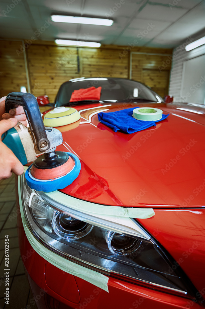 Preparing the car for sale at a service station.