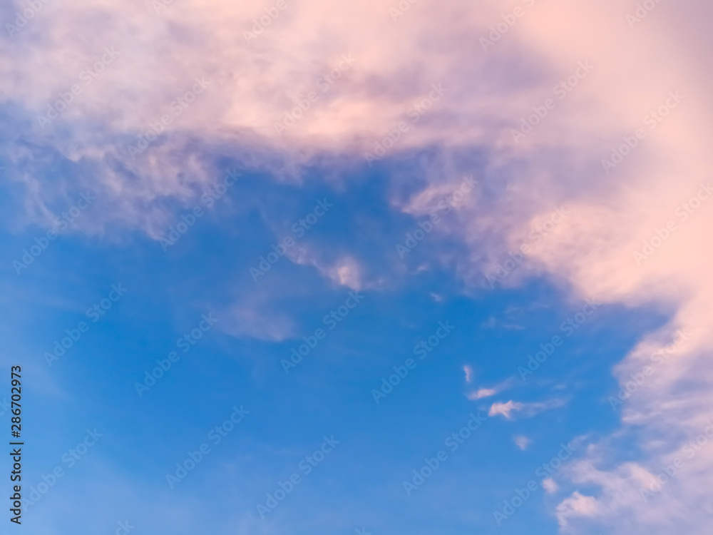 Natural sunset sunrise and light streaming through clouds over the road in twilight period . Bright dramatic Sky at horizon . clouds in sunset Concept