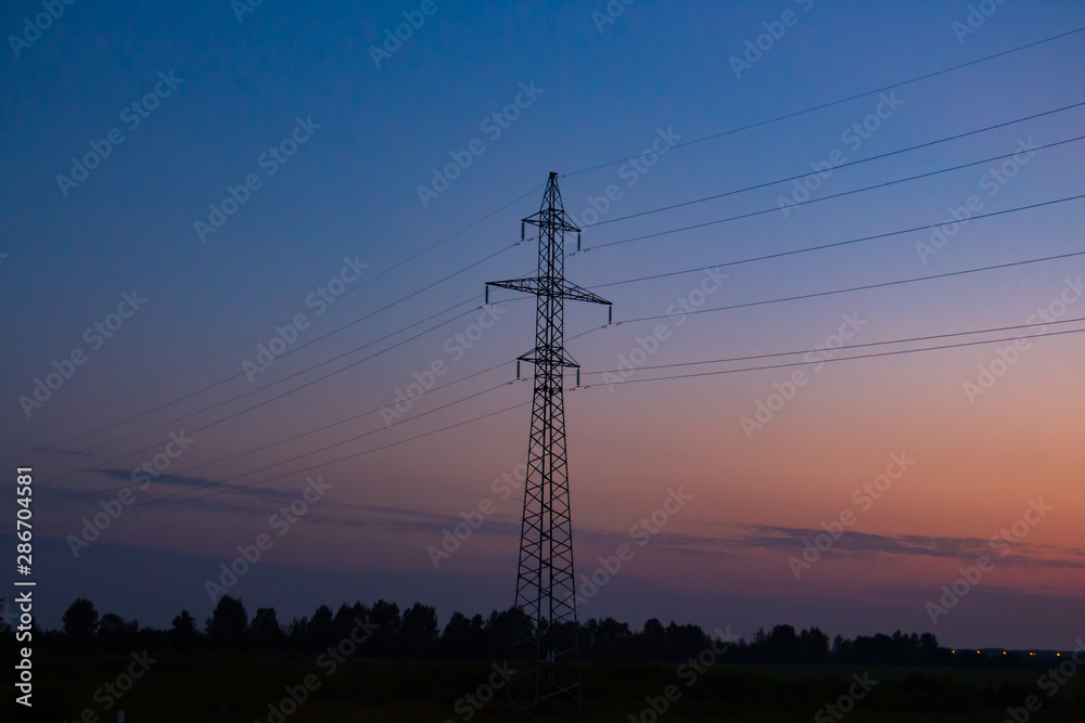 Fototapeta premium electric poles on the background of sunrise