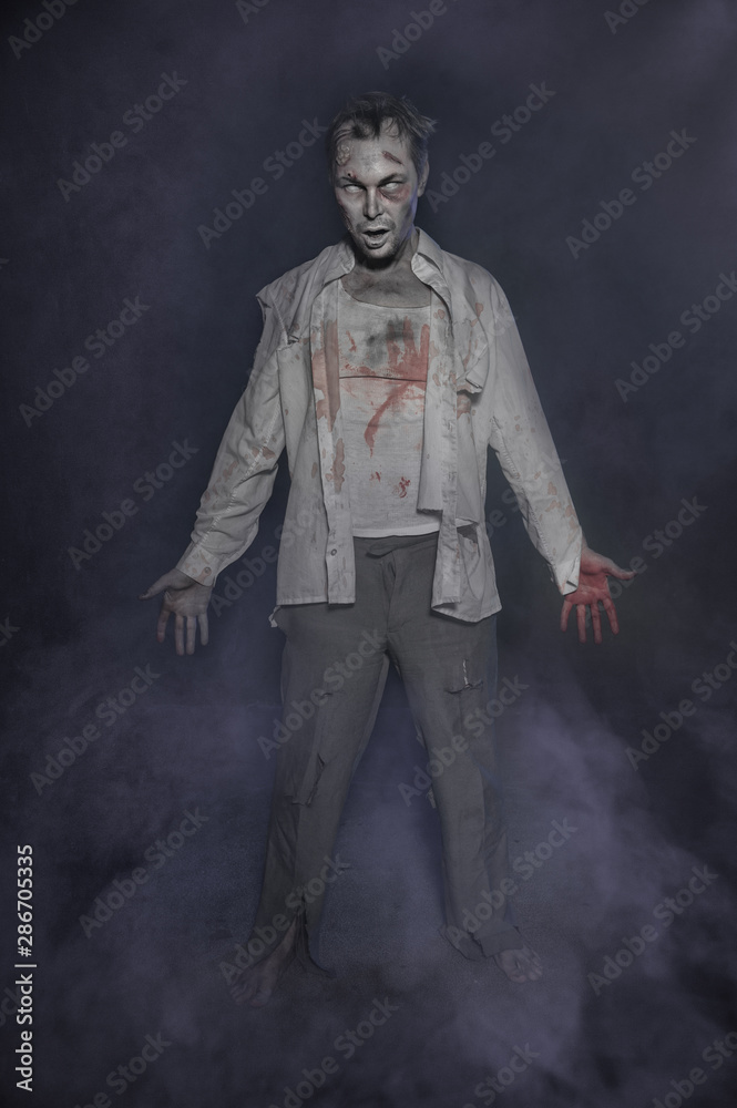 Fototapeta premium Horror terrible zombie man. Halloween scene