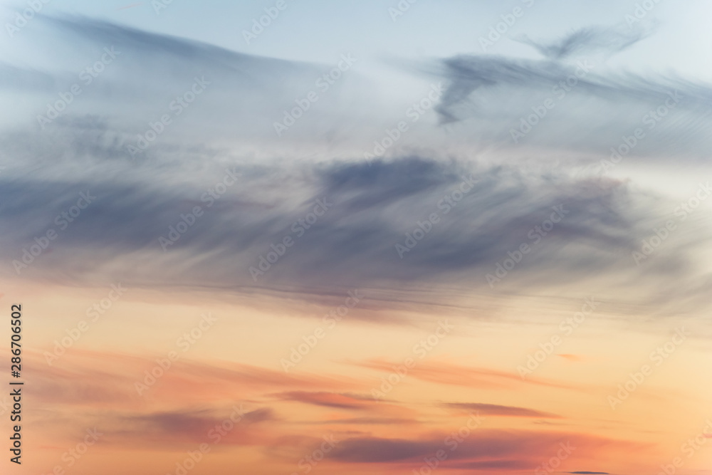 sunset background. sky with soft and blur pastel colored clouds. sunshine through the gradient cloud on the beach resort. nature. sunrise. peaceful morning sunset background. sky with soft and blur pastel colored clouds. sunshine through the gradient cloud on the beach resort. nature. sunrise. peaceful morning