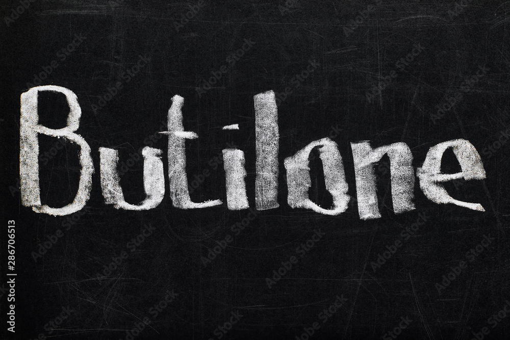 Fototapeta premium top view of black chalk board with lettering butilone