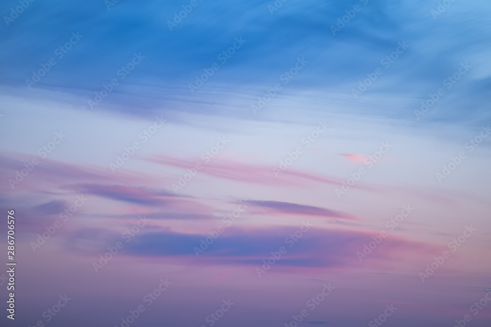 sunset background. sky with soft and blur pastel colored clouds. sunshine through the gradient cloud on the beach resort. nature. sunrise. peaceful morning sunset background. sky with soft and blur pastel colored clouds. sunshine through the gradient cloud on the beach resort. nature. sunrise. peaceful morning