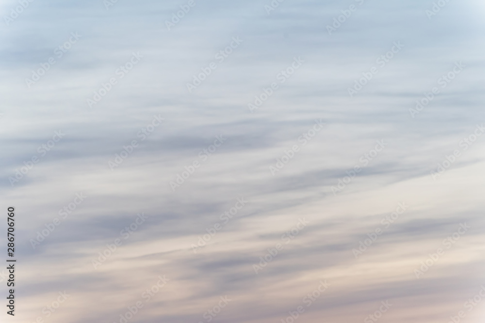 sunset background. sky with soft and blur pastel colored clouds. sunshine through the gradient cloud on the beach resort. nature. sunrise. peaceful morning sunset background. sky with soft and blur pastel colored clouds. sunshine through the gradient cloud on the beach resort. nature. sunrise. peaceful morning
