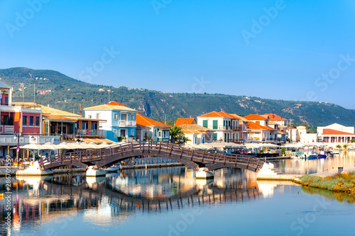 Lefkas (Lefkada) town, amazing view at the small marina for the fishing boats with the nice wooden bridge and promenade, Ionian island, Greece photo