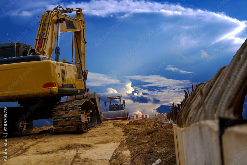Obraz premium yellow excavator on construction site