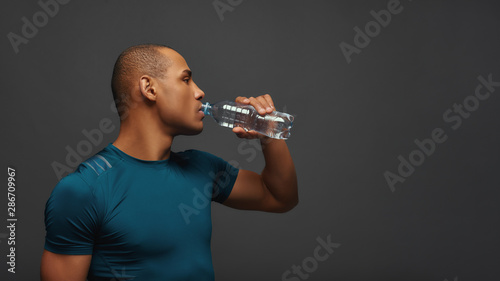 Don't forget to drink enough. Sportsman having work out