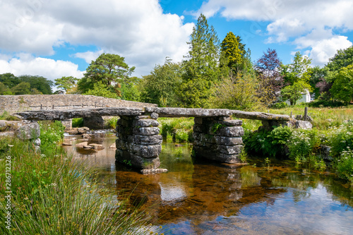 Ancient clapper bridge in Postbridge, Dartmoor National Park, Devon, England