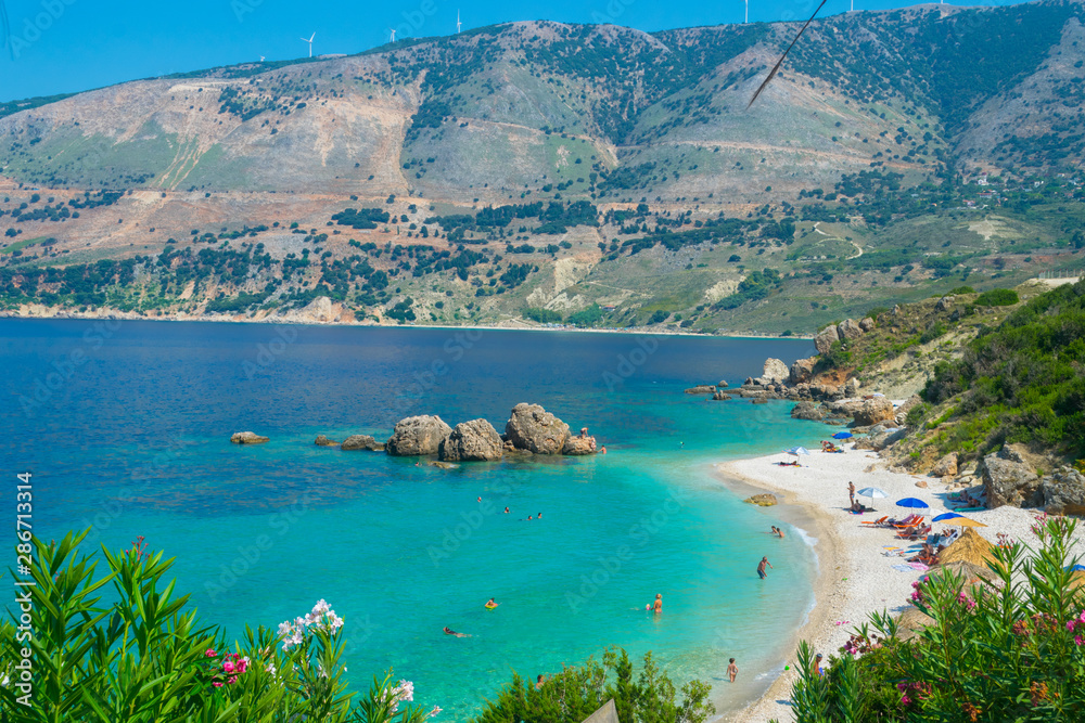 Naklejka premium Vouti beach in Kefalonia ionian island, Greece. A secluded majestic beach with turquoise sea waters